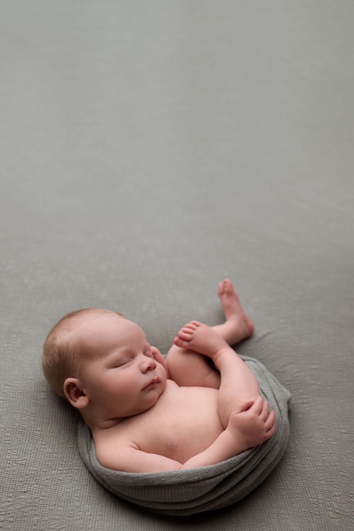 Newborn baby during newborn session with Bree Elle Photography in Port Neches, TX studio. Lumberton, Silsbee, Beaumont, Nederland, Southeast