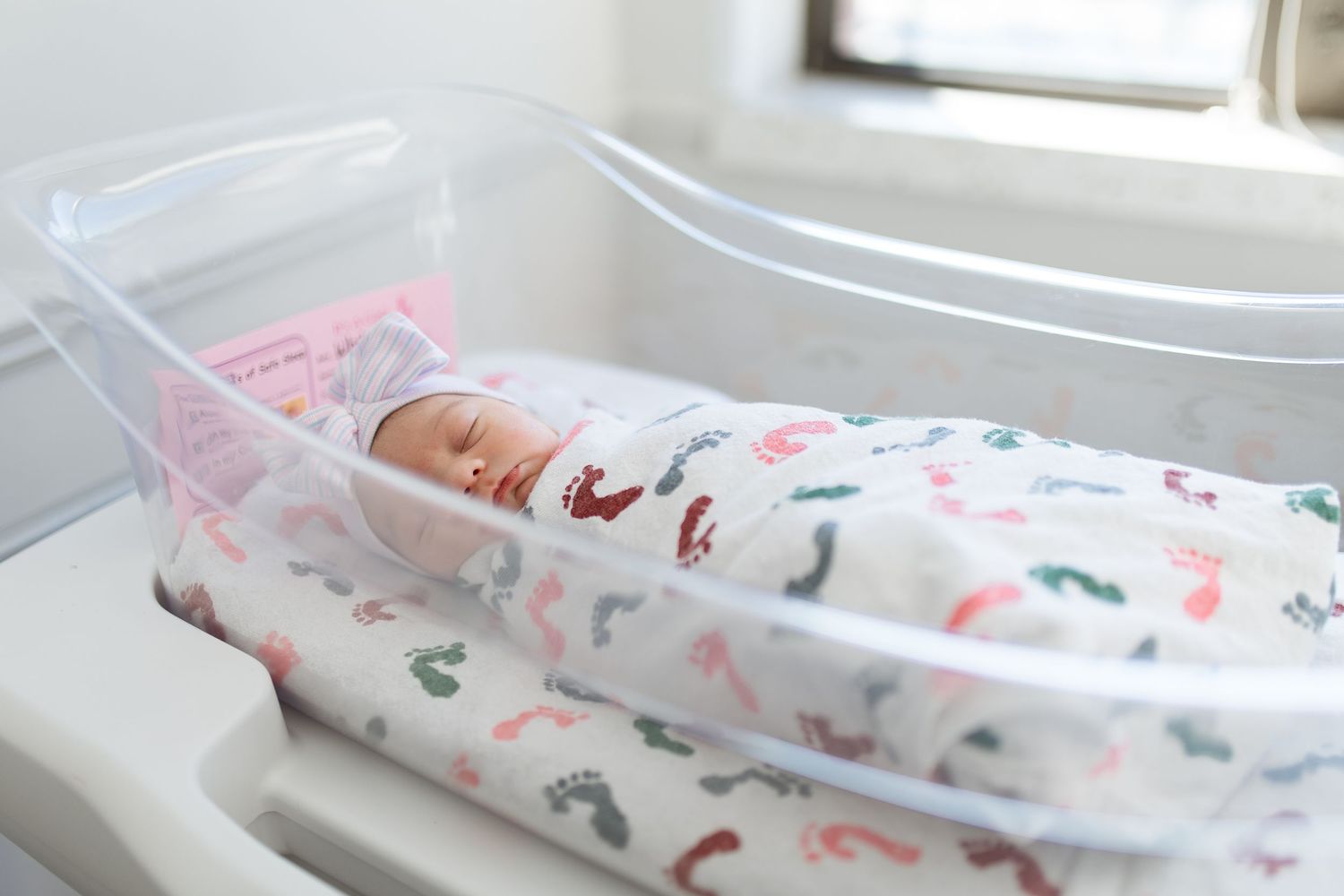 Newborn baby in bassinet swaddled during their Fresh 48 session with Bree Elle Photography in Beaumont, TX at St. Elizabeth hospital.