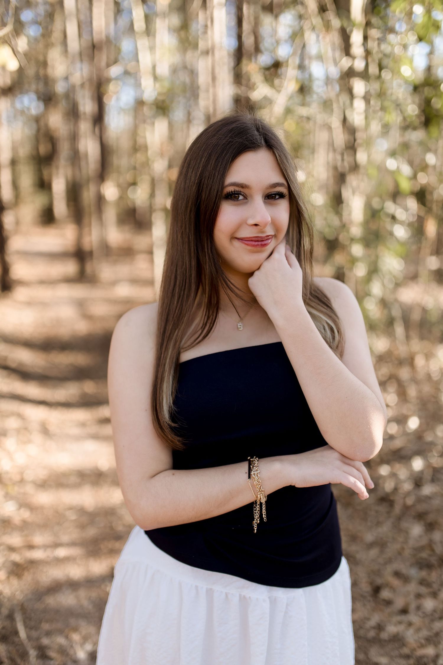 High School Senior taking graduation photos in Silsbee, TX with Bree Elle Photography's associate photographer, Alicia.