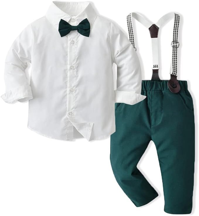 Elegant boys formal outfit with white dress shirt, emerald green bow tie and suspender pants for special occasions.