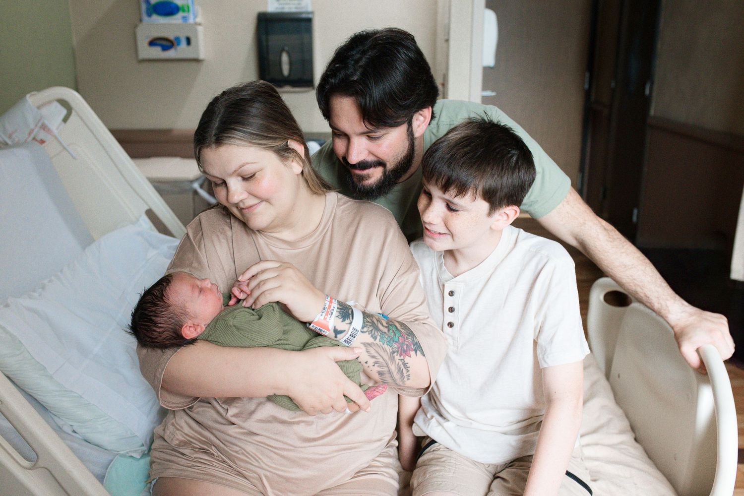 Fresh 48 session at Baptist Hospital in Beaumont, TX with Bree Elle Photography. Family posing with newborn baby boy.