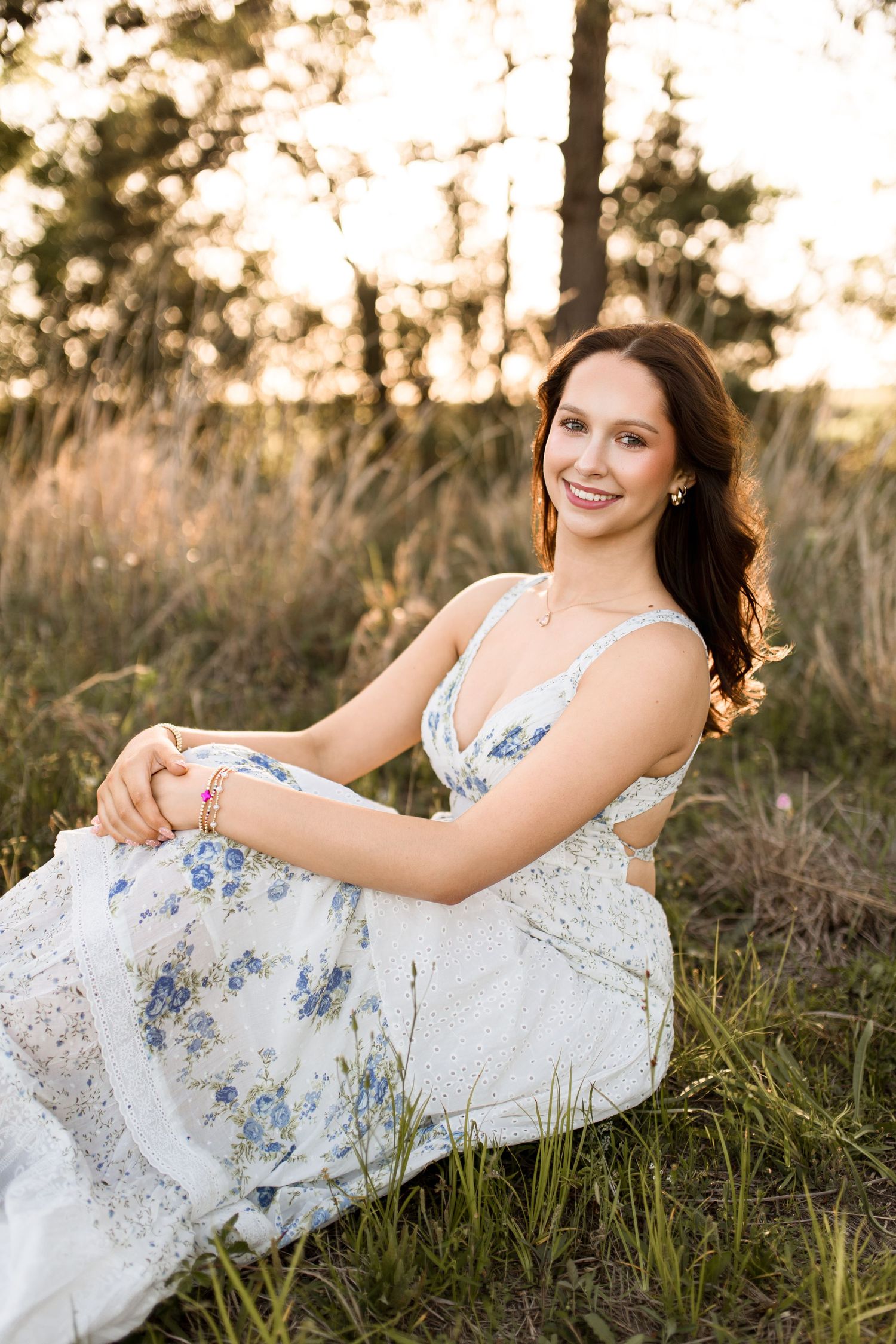 Bree Elle Photography by Alicia Stephenson with graduating senior in a field in Beaumont, TX.