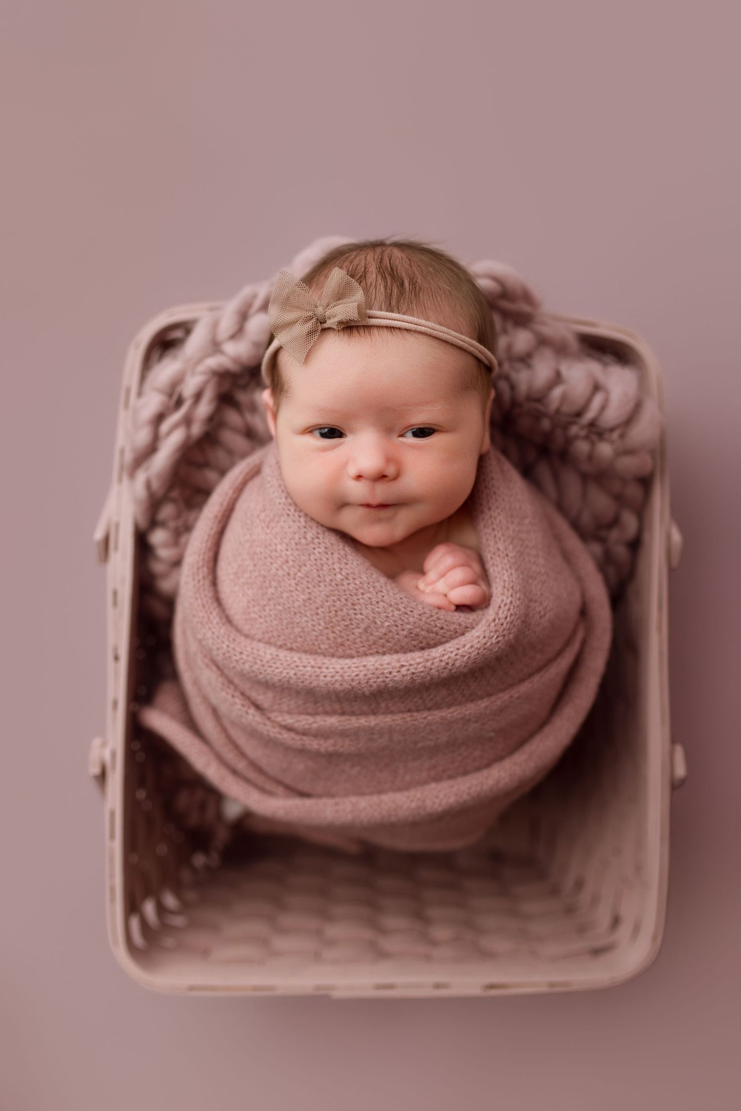 Baby girl during newborn session with Bree Elle Photography in Port Neches, TX studio.