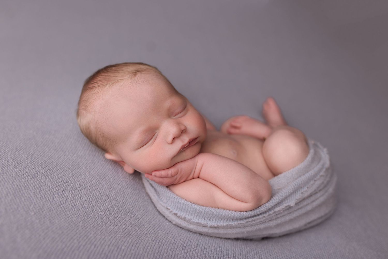 Newborn baby during newborn session with Bree Elle Photography in Port Neches, TX studio. Lumberton, Silsbee, Beaumont, Nederland, Southeast