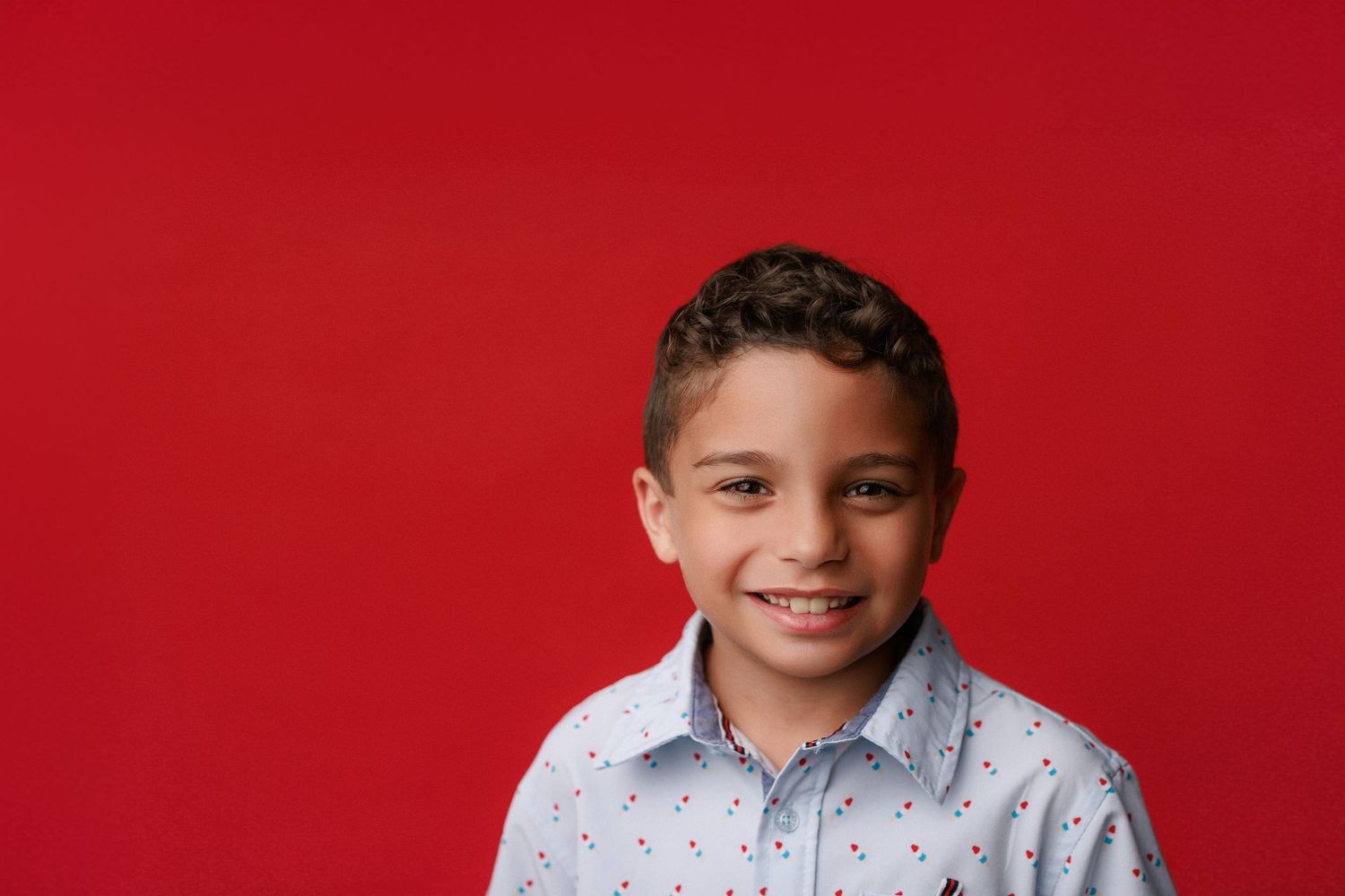 Bridge City kinder graduation portrait session with cap and gown in Port Neches, TX with Bree Elle Photography.