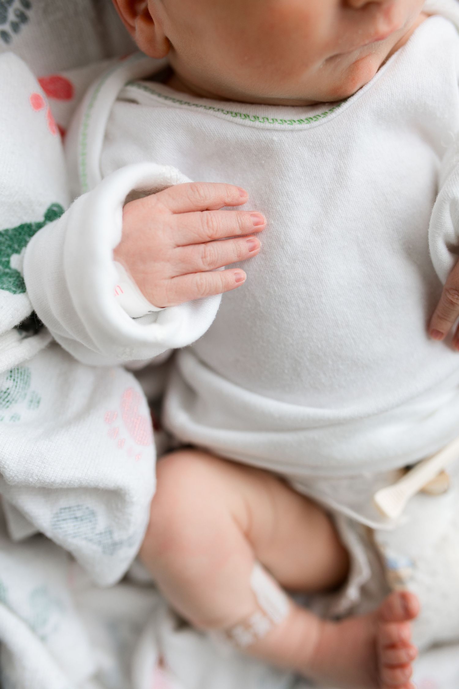 Newborn baby during Fresh 48 session at St. Elizabeth Hospital in Beaumont, TX. Photographed by Bree Elle Photography.
