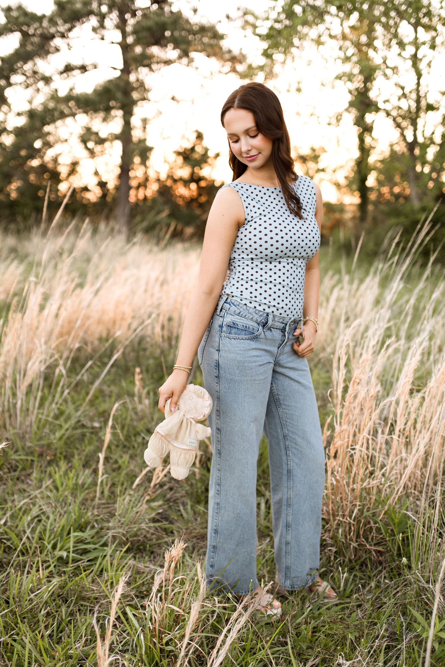 Bree Elle Photography Seniors by Alicia Stephenson. Session with girl in a Beaumont, TX field during senior year photo session.