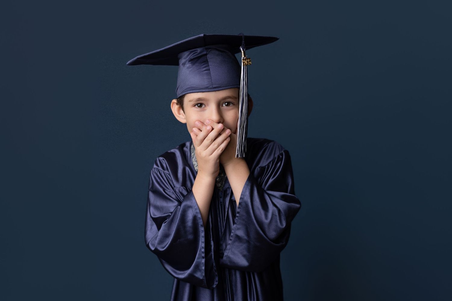 Kinder graduation portrait session with cap and gown in Port Neches, TX with Bree Elle Photography.