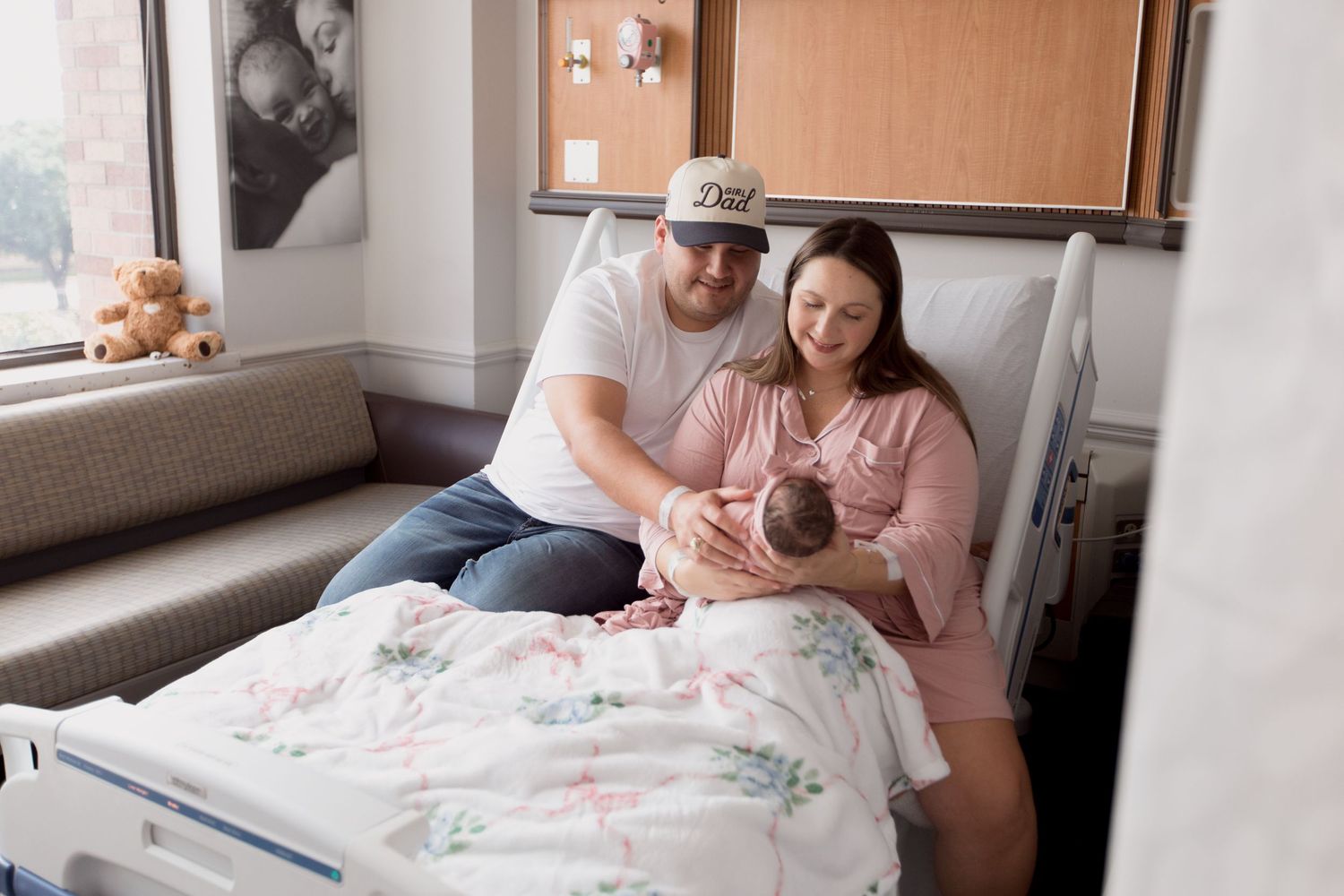 Parents tenderly attending to their newborn during Fresh 48 session in Beaumont hospital.