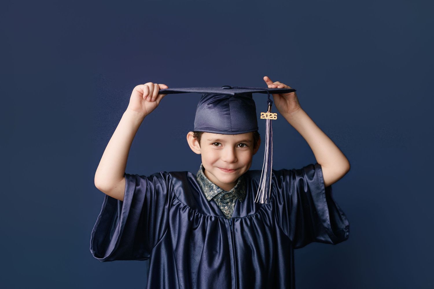 Kinder graduation portrait session with cap and gown in Port Neches, TX with Bree Elle Photography.