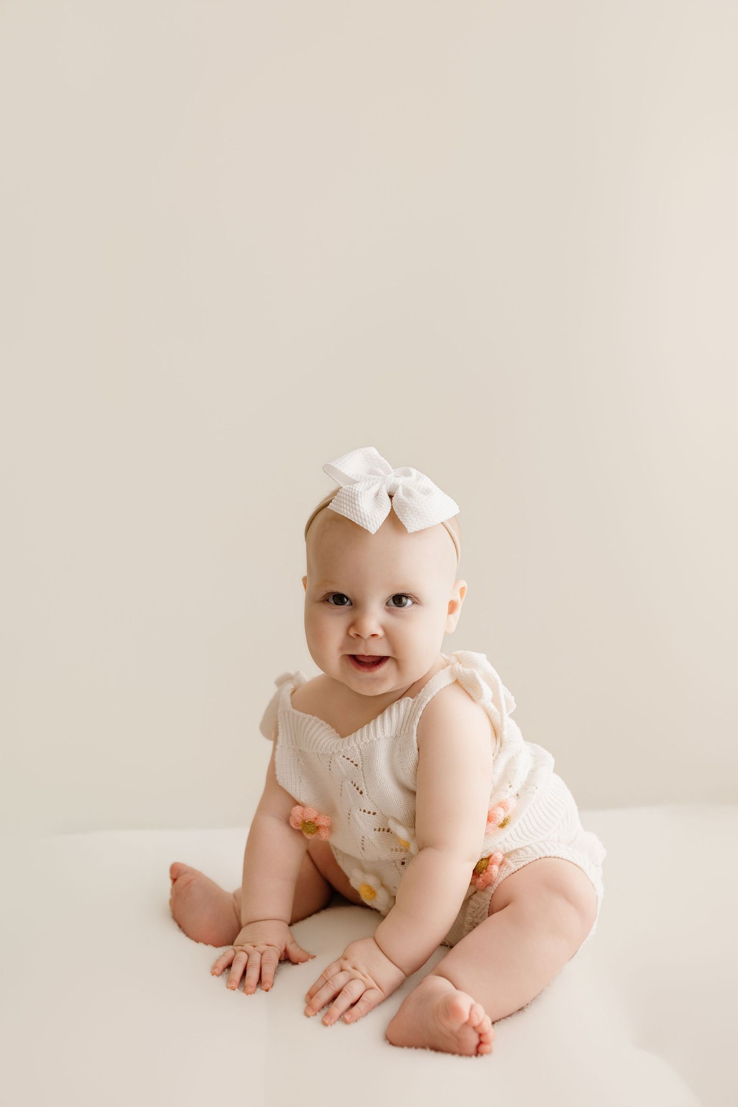 6 month old during her milestone session with Bree Elle Photography in Port Neches, TX studio.
