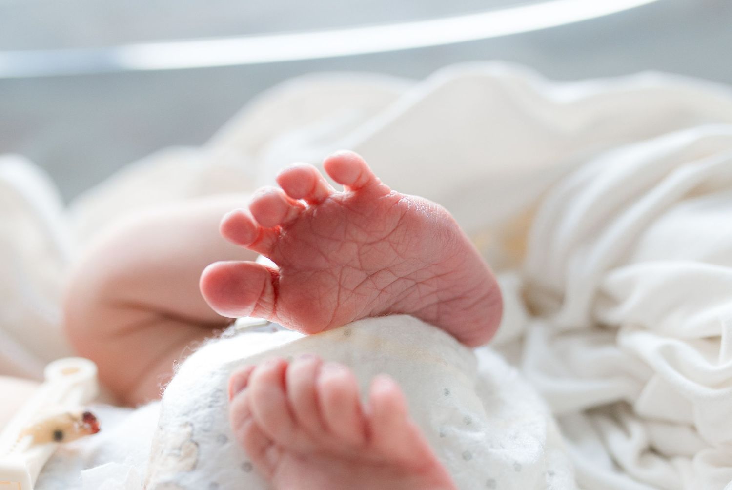 Newborn baby during Fresh 48 session at St. Elizabeth Hospital in Beaumont, TX. Photographed by Bree Elle Photography.