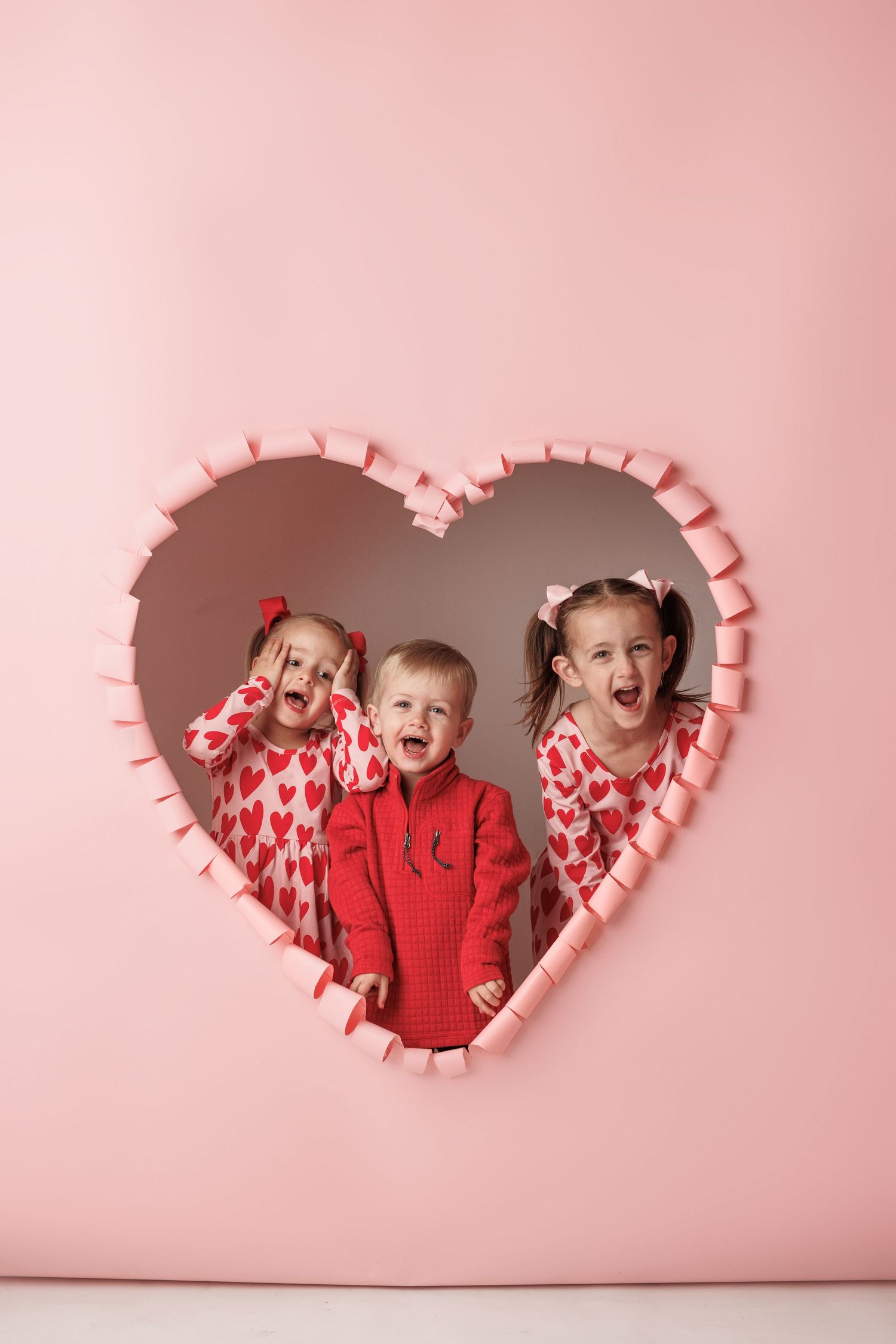 Three Valentine's themed photos showing a heart-shaped cutout against a pink backdrop.
