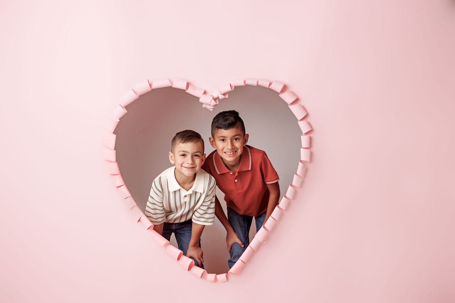 Valentine's themed photo series with heart-shaped cutouts and pink backdrop.