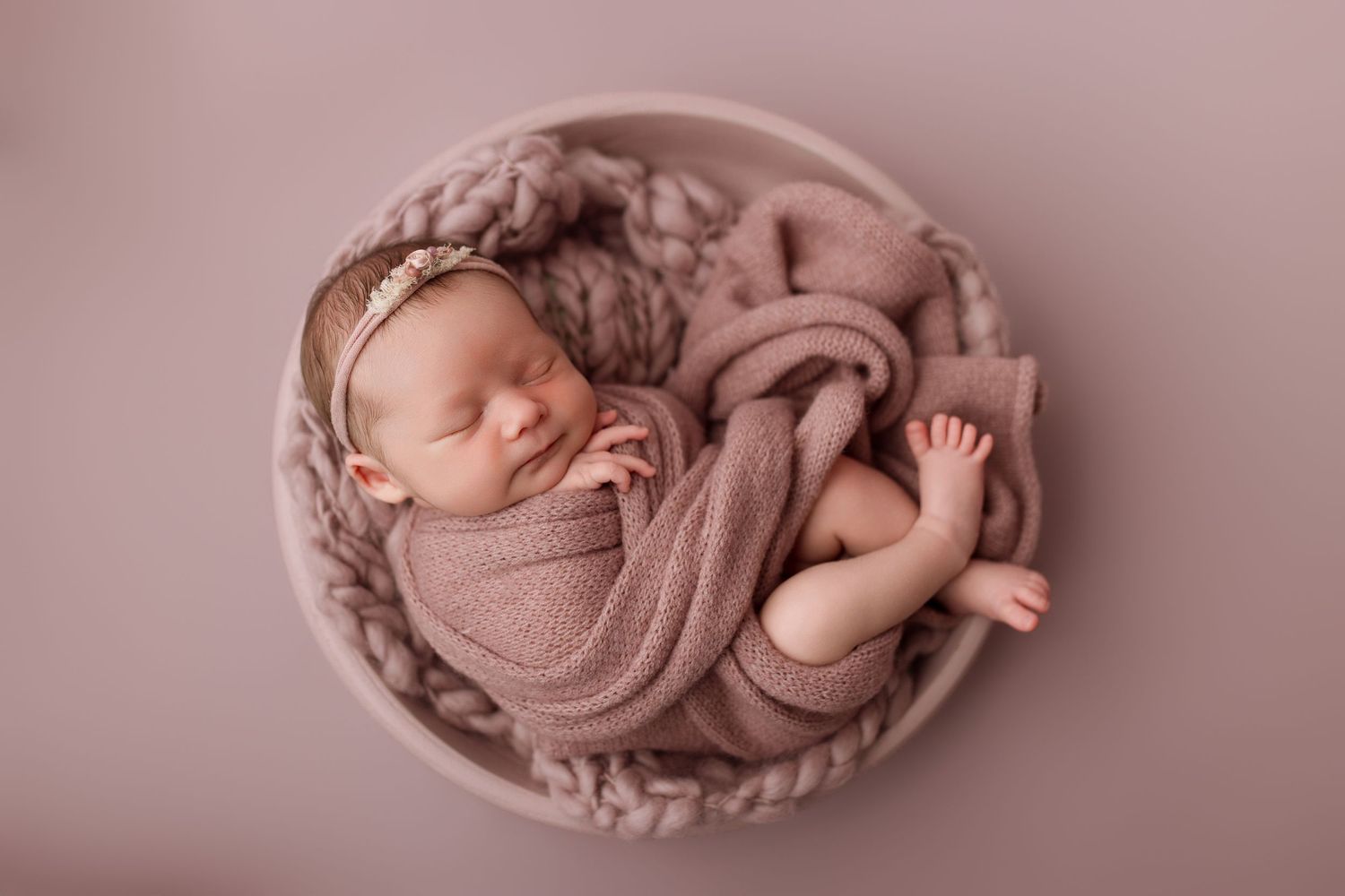 Baby girl during newborn session with Bree Elle Photography in Port Neches, TX studio.