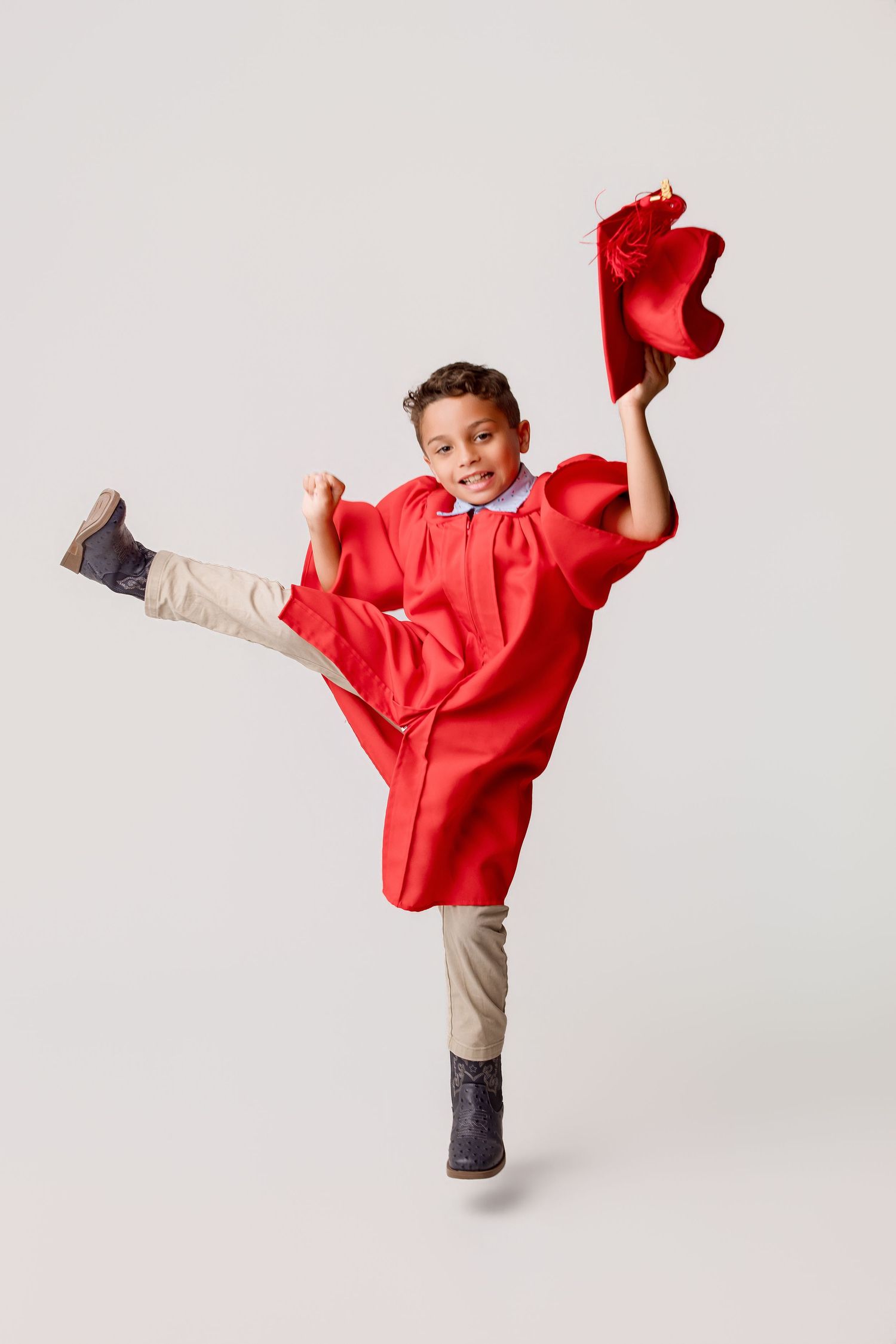 Bridge City kinder graduation portrait session with cap and gown in Port Neches, TX with Bree Elle Photography.