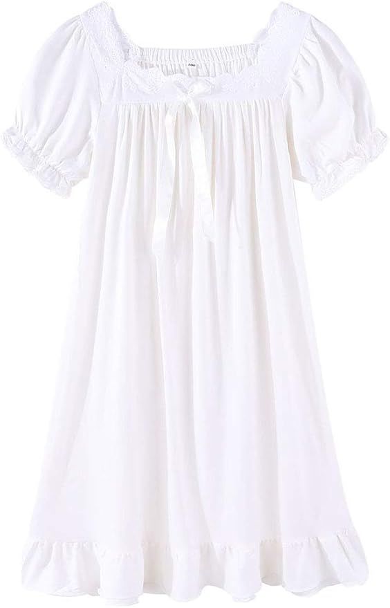 White cotton peasant blouse with short puff sleeves and gathered neckline on white background.