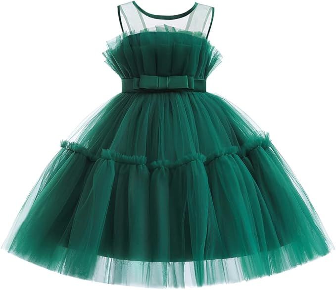 Green tulle party dresses with bow details shown in different sizes arranged in a row against white background.