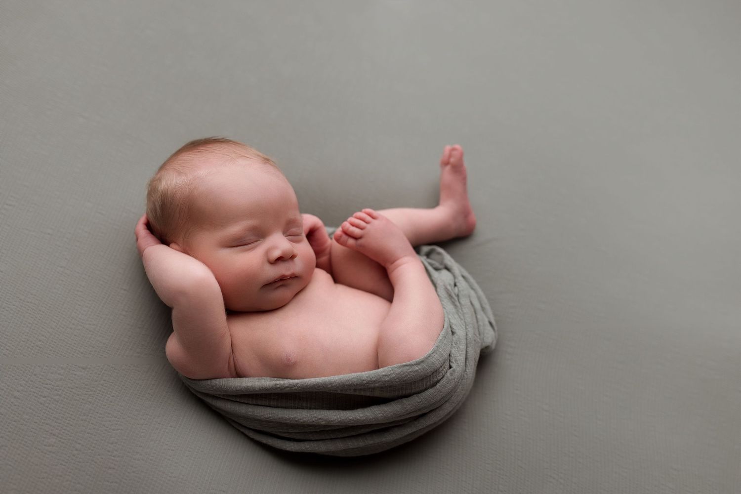 Newborn baby during newborn session with Bree Elle Photography in Port Neches, TX studio. Lumberton, Silsbee, Beaumont, Nederland, Southeast
