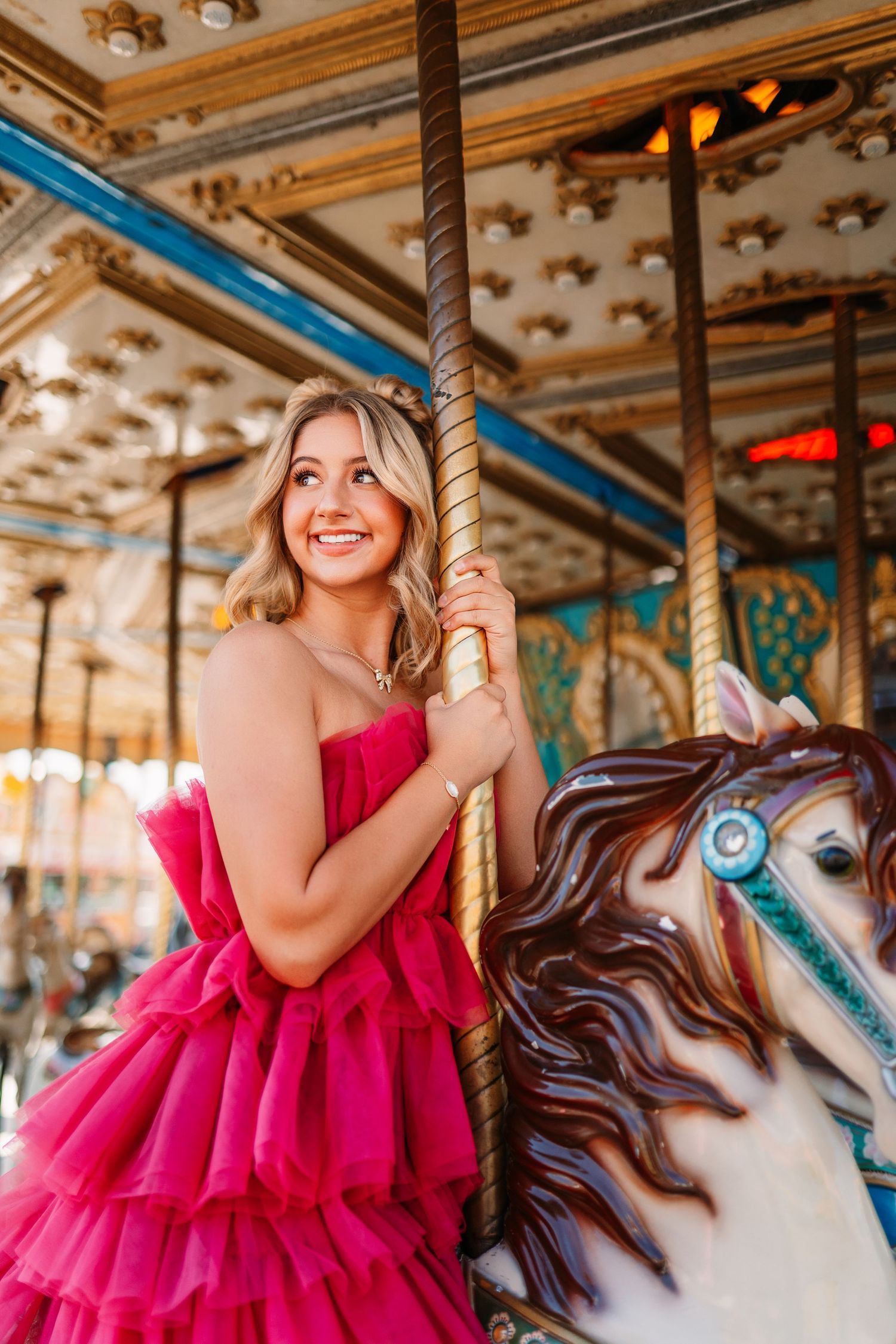 An ornate vintage carousel setting with decorative details and warm lighting.