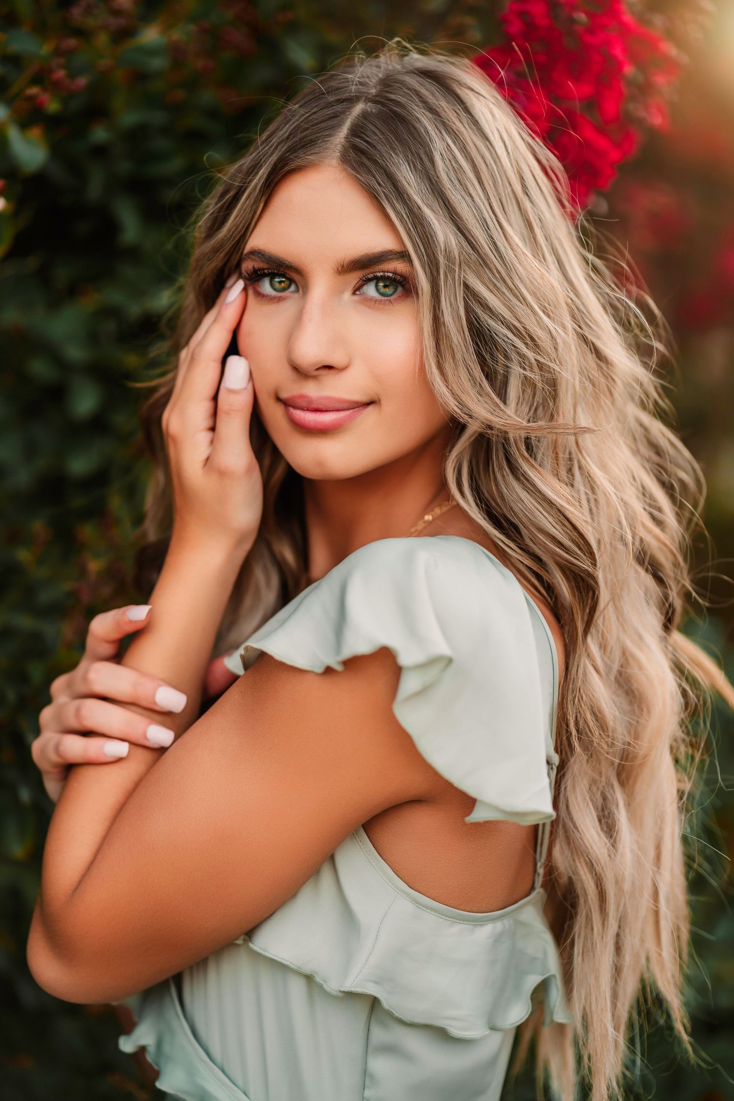 Portrait series featuring someone in a mint ruffle top with dramatic lighting.