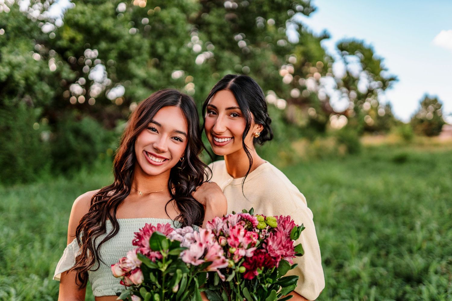 Two people hold flowers while sharing a joyful moment in a sunny green field.senior session
Albuquerque senior photographer
Rio Rancho