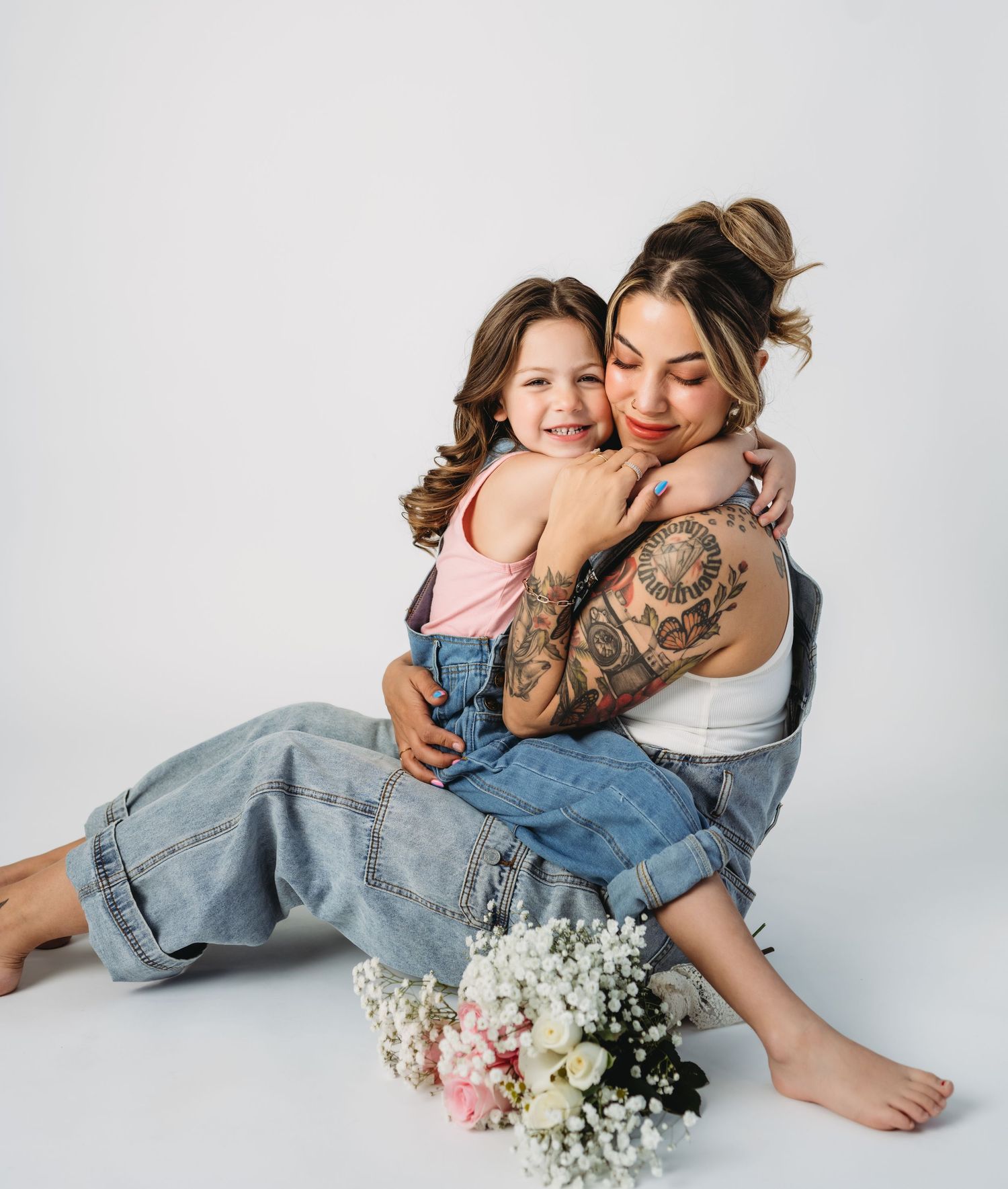 Studio portraits with delicate baby's breath flowers on white background.