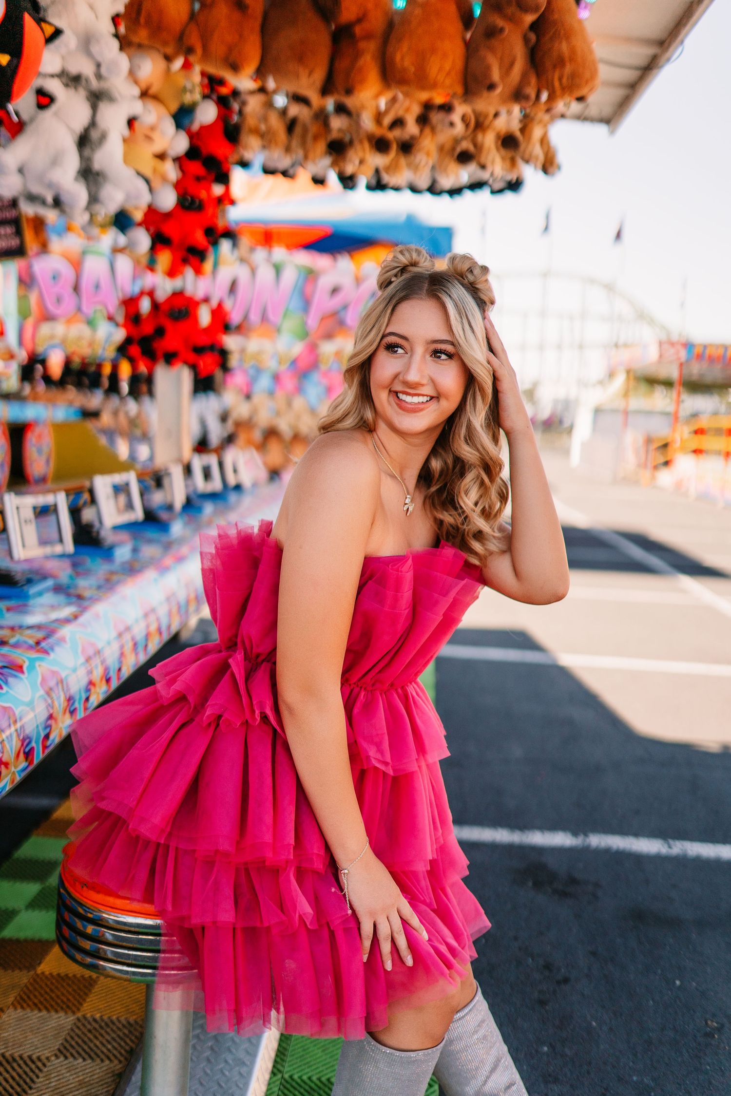 Bright carnival setting with plush toys and festive decorations.