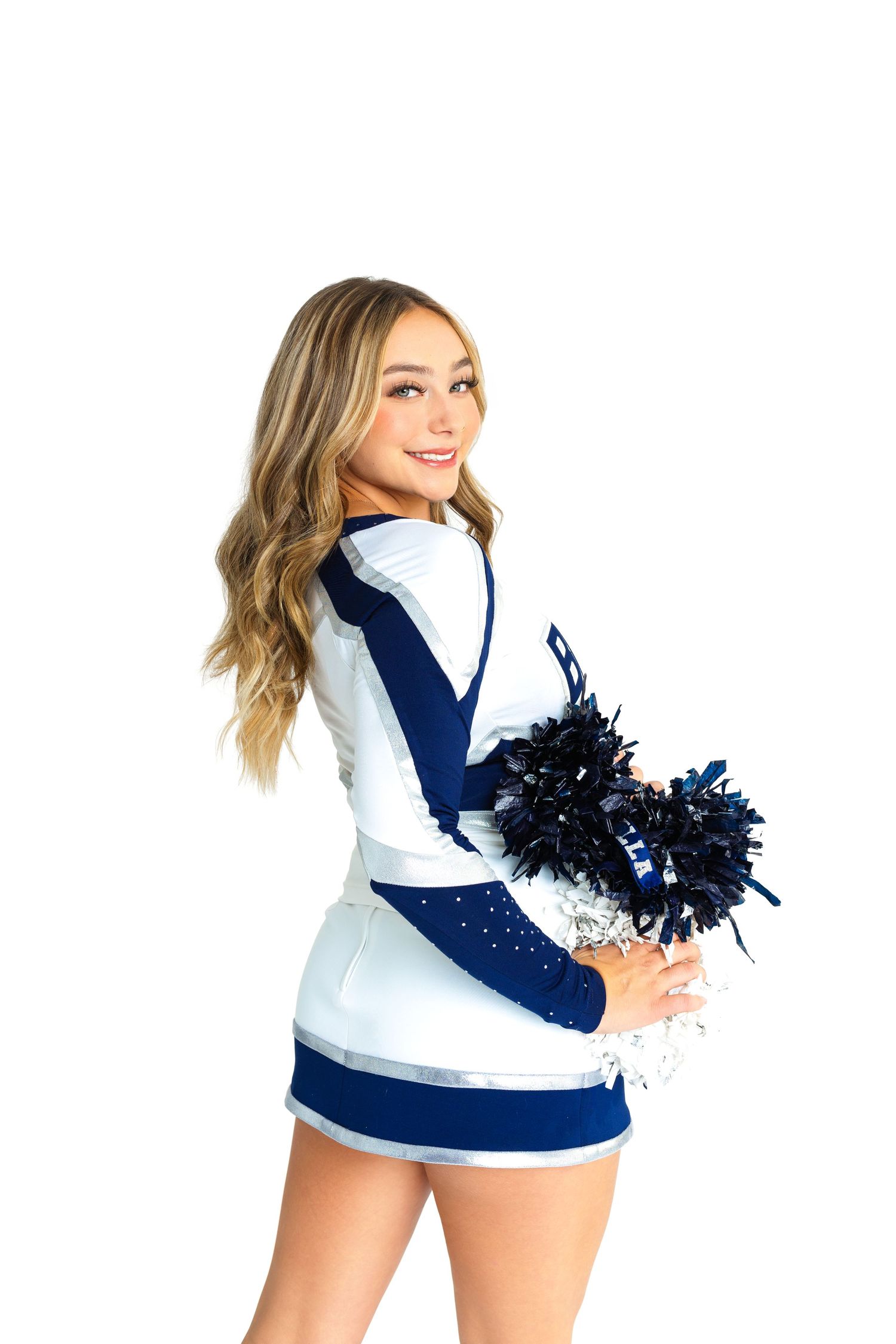 Cheerleader portraits in navy and white uniform with pom poms.