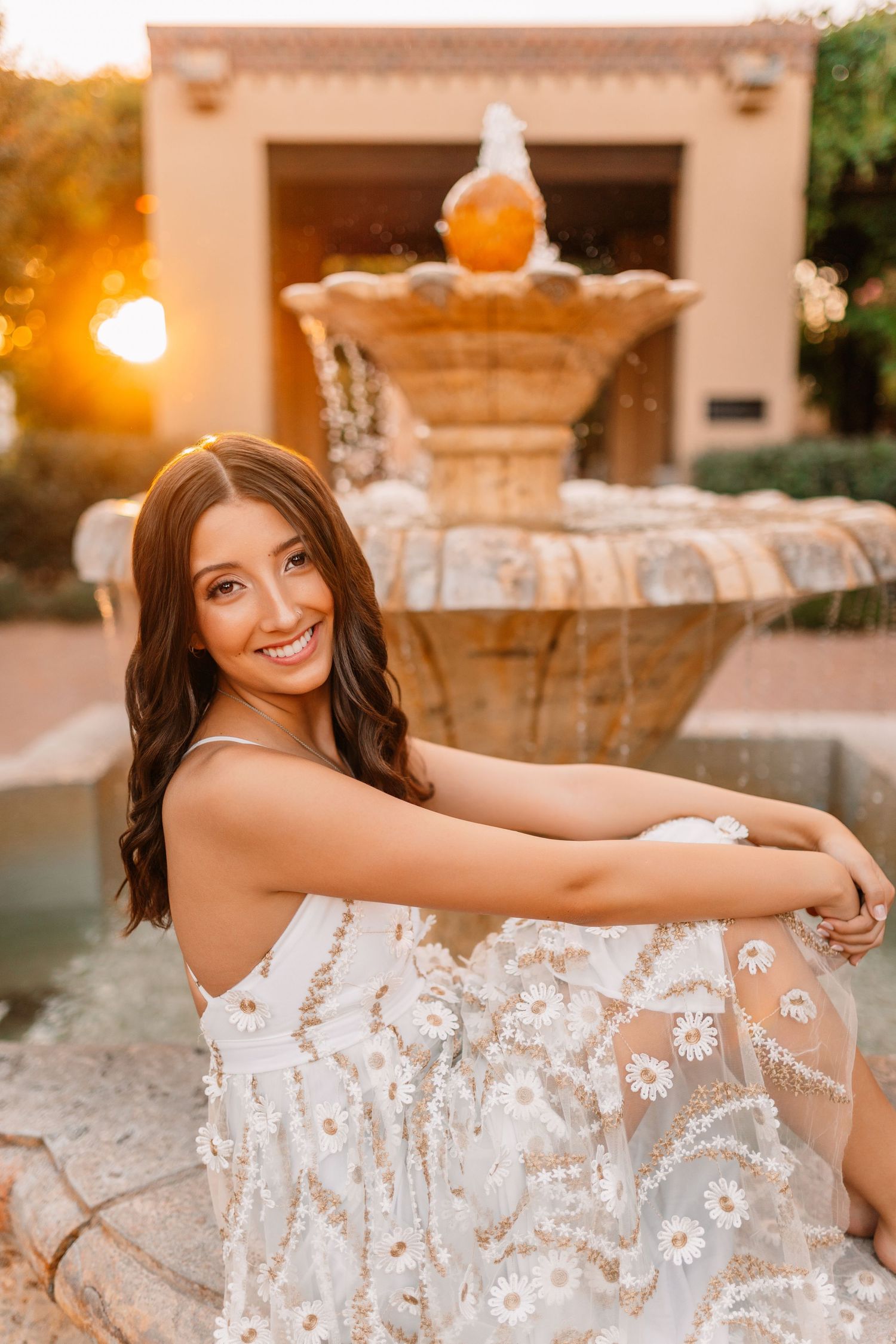 Sunset portraits by a decorative fountain with warm golden lighting.portraits, images, session, photo shoot