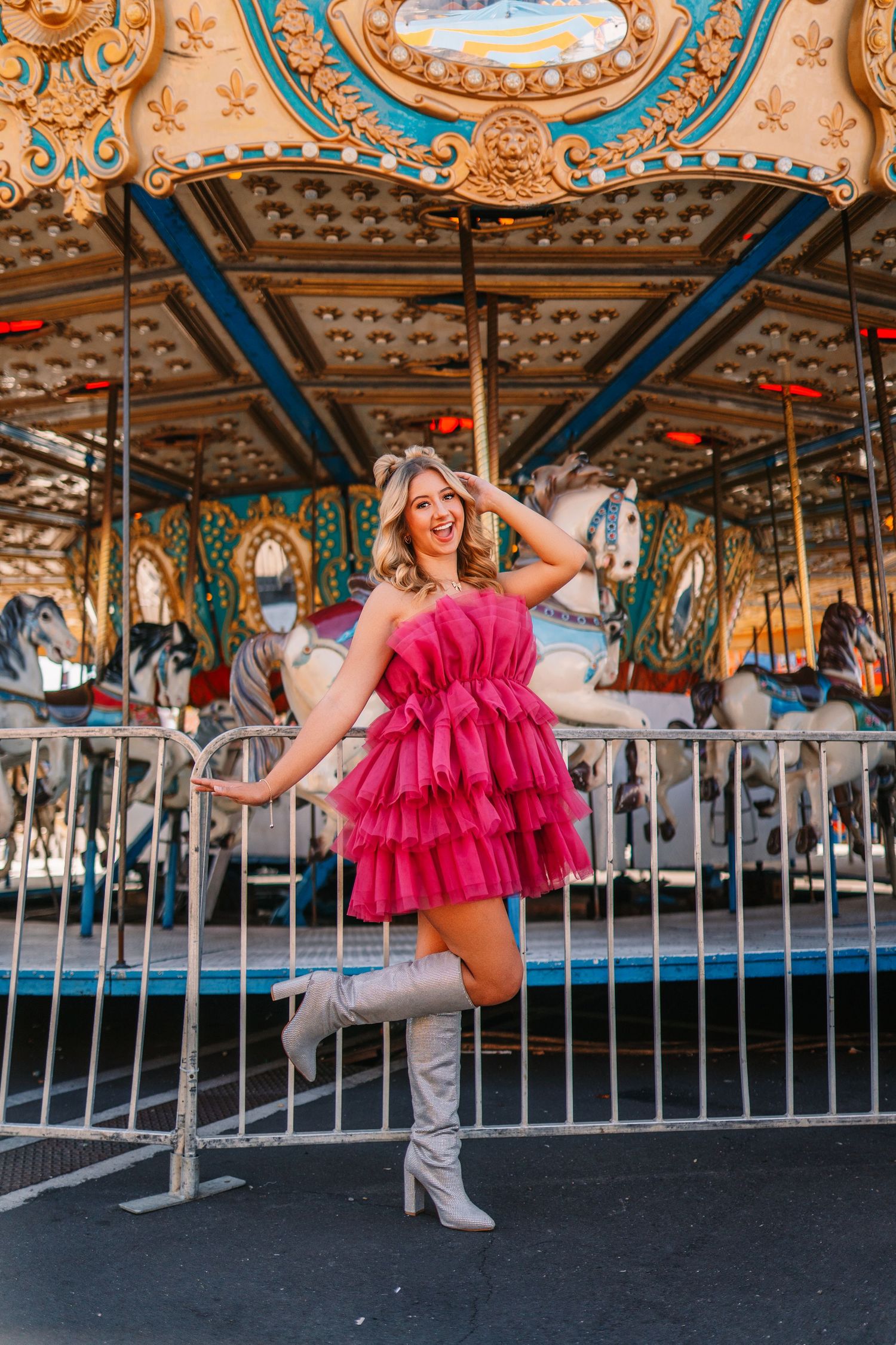 A playful carousel photoshoot showcasing vintage carnival architecture and design.