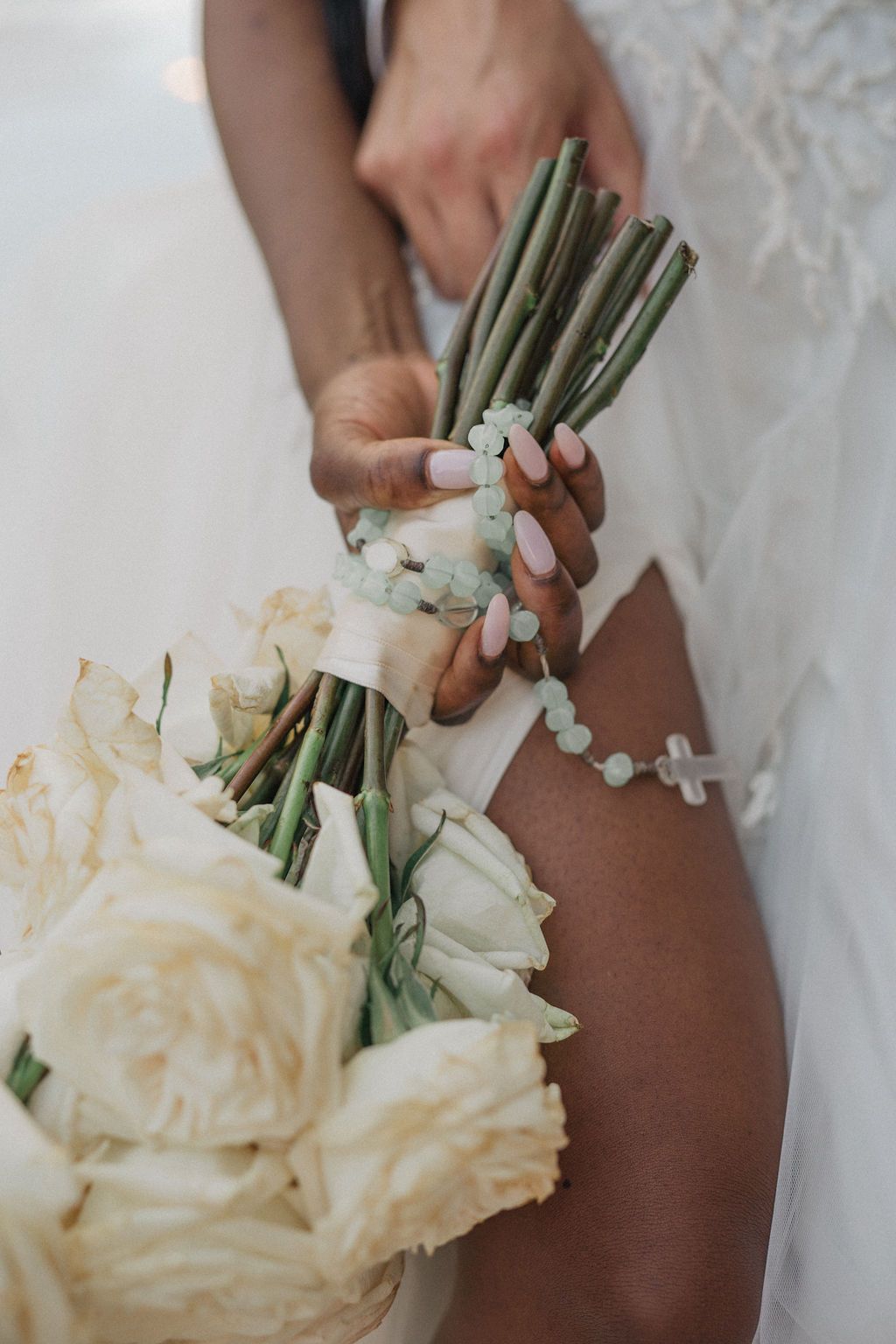 Close-up of a bridal bouquet with white roses and delicate flowers.
