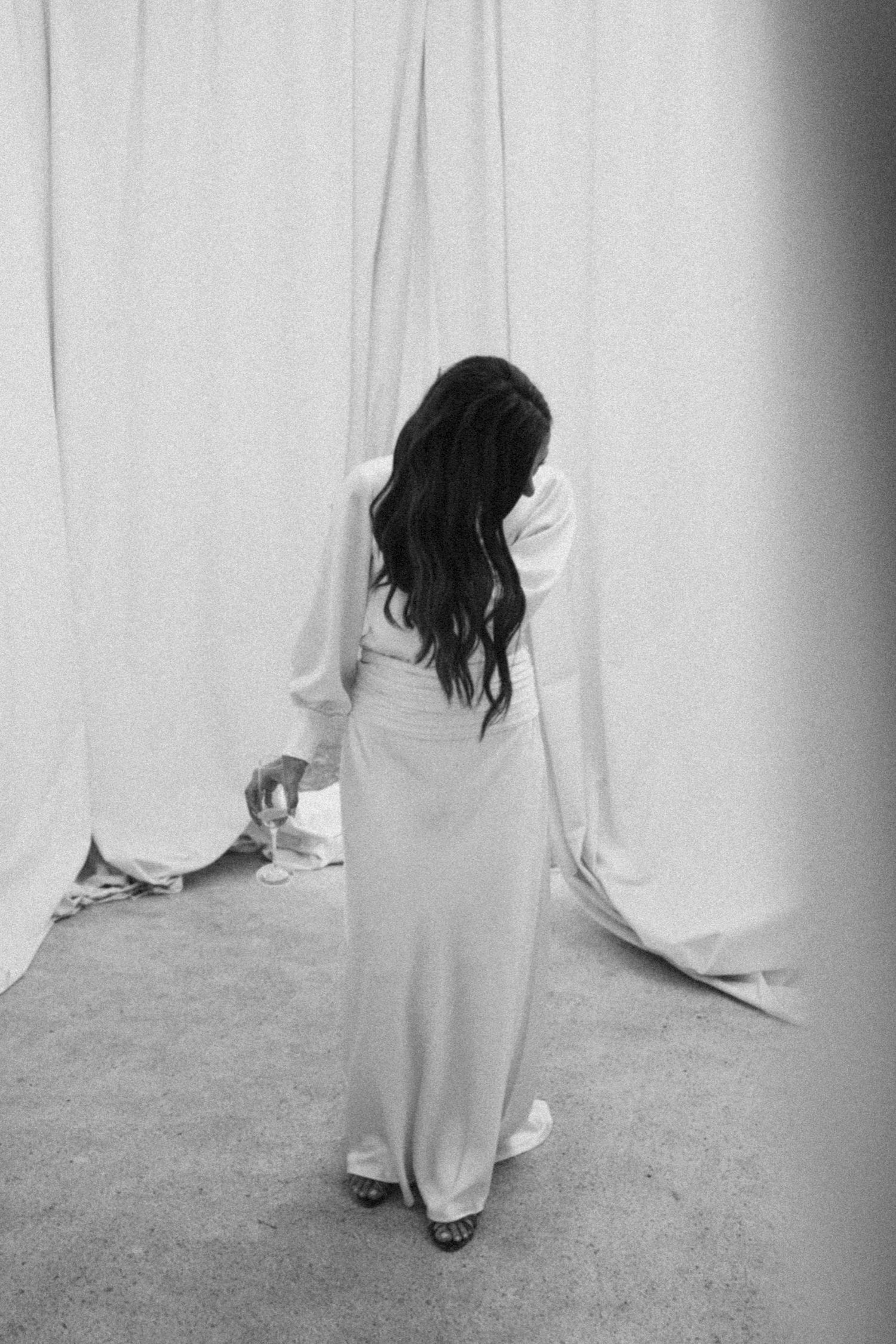 Ethereal photo sequence showing flowing white fabric and graceful movement in monochrome.