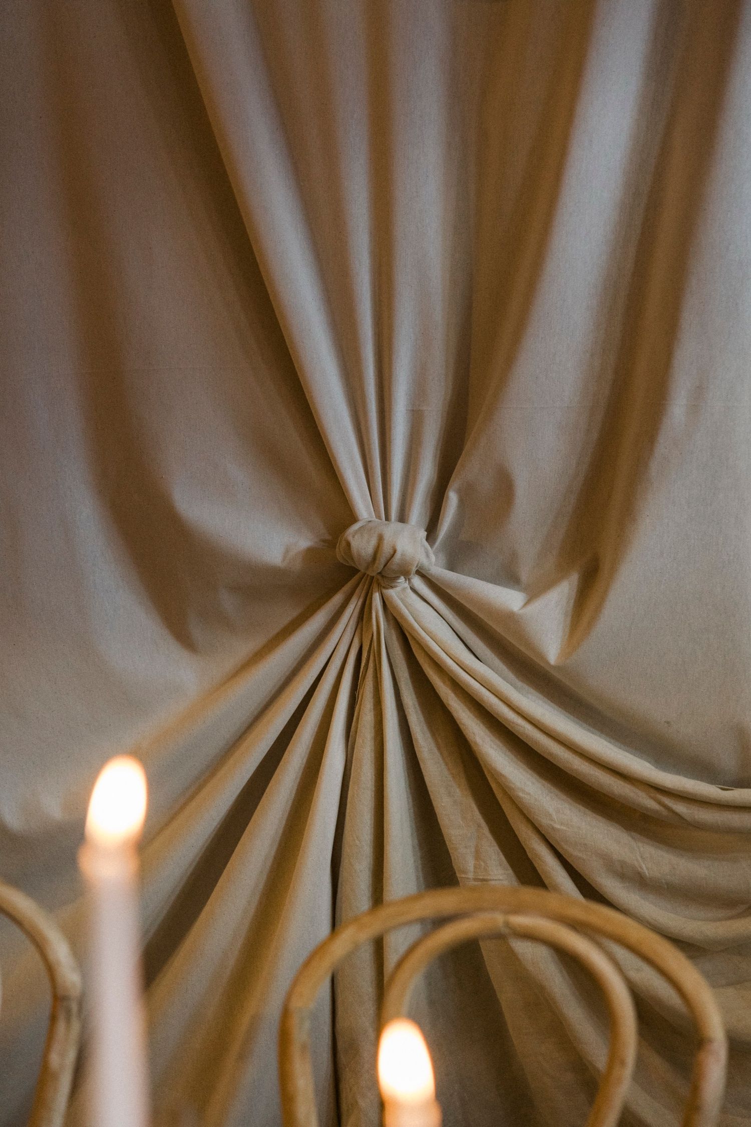 Dramatic ceiling draping detail with gathered fabric creating an elegant tent-like effect.