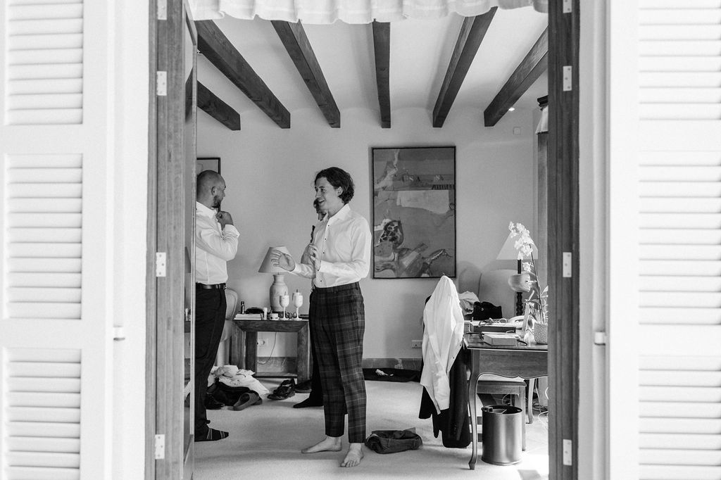 Black and white interior shot showing preparation space with beamed ceiling.