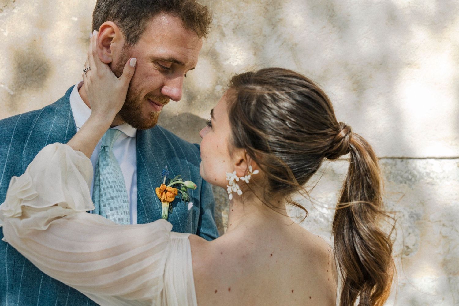 A romantic wedding couple shares tender moments in a series of candid shots showing affection and joy.