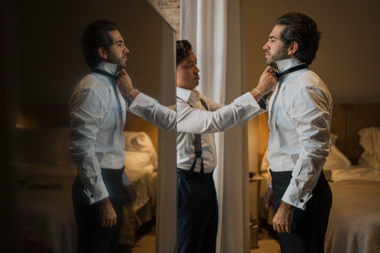 A sequence of photos showing a couple in white shirts dancing together in a warmly lit room.
