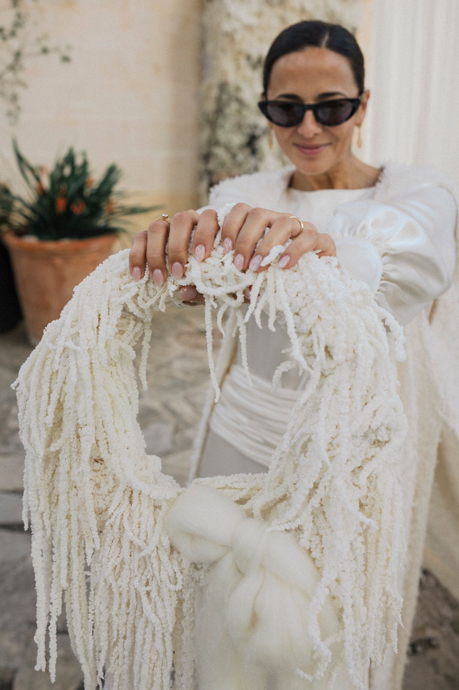 Close-up of elegant bridal accessories with fringe details and delicate craftsmanship.