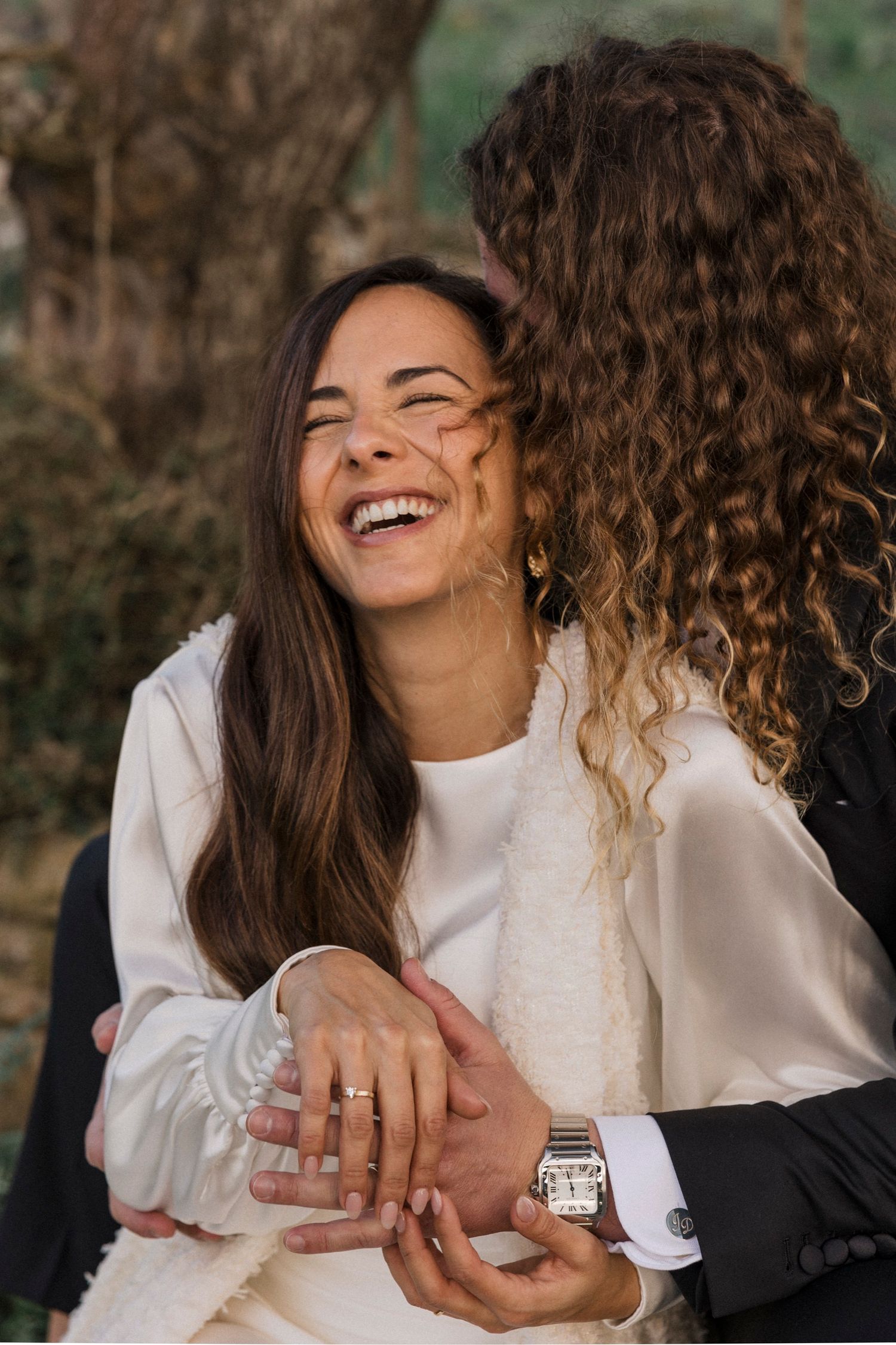Close-up of genuine laughter and joy captured during an intimate moment outdoors.