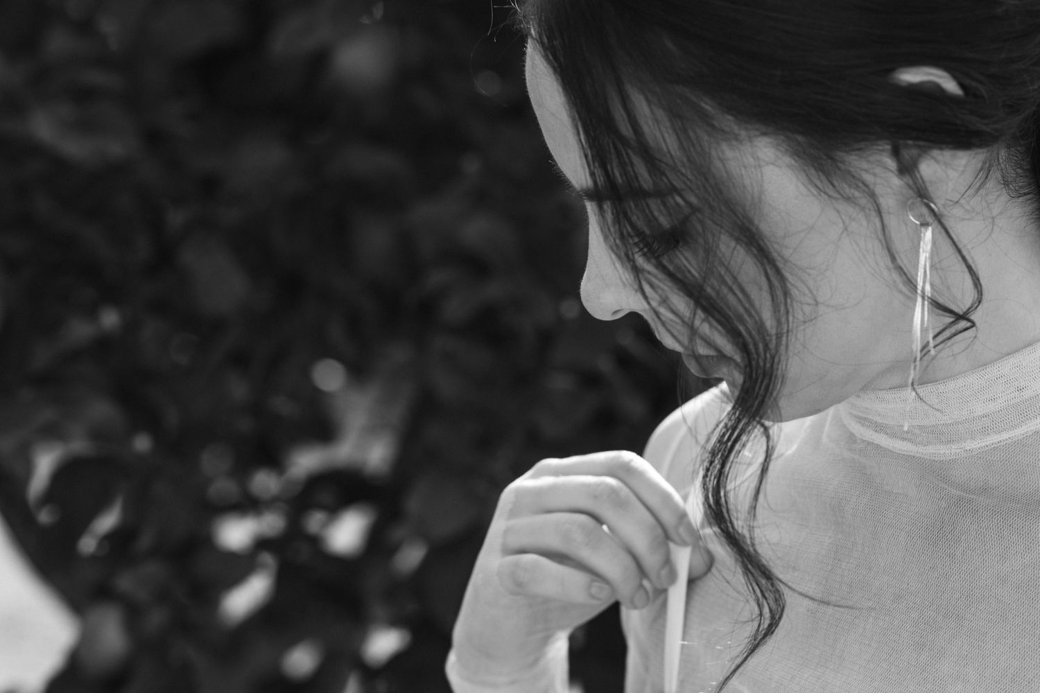 A series of black and white close-up wedding photos showing intimate moments between a couple.