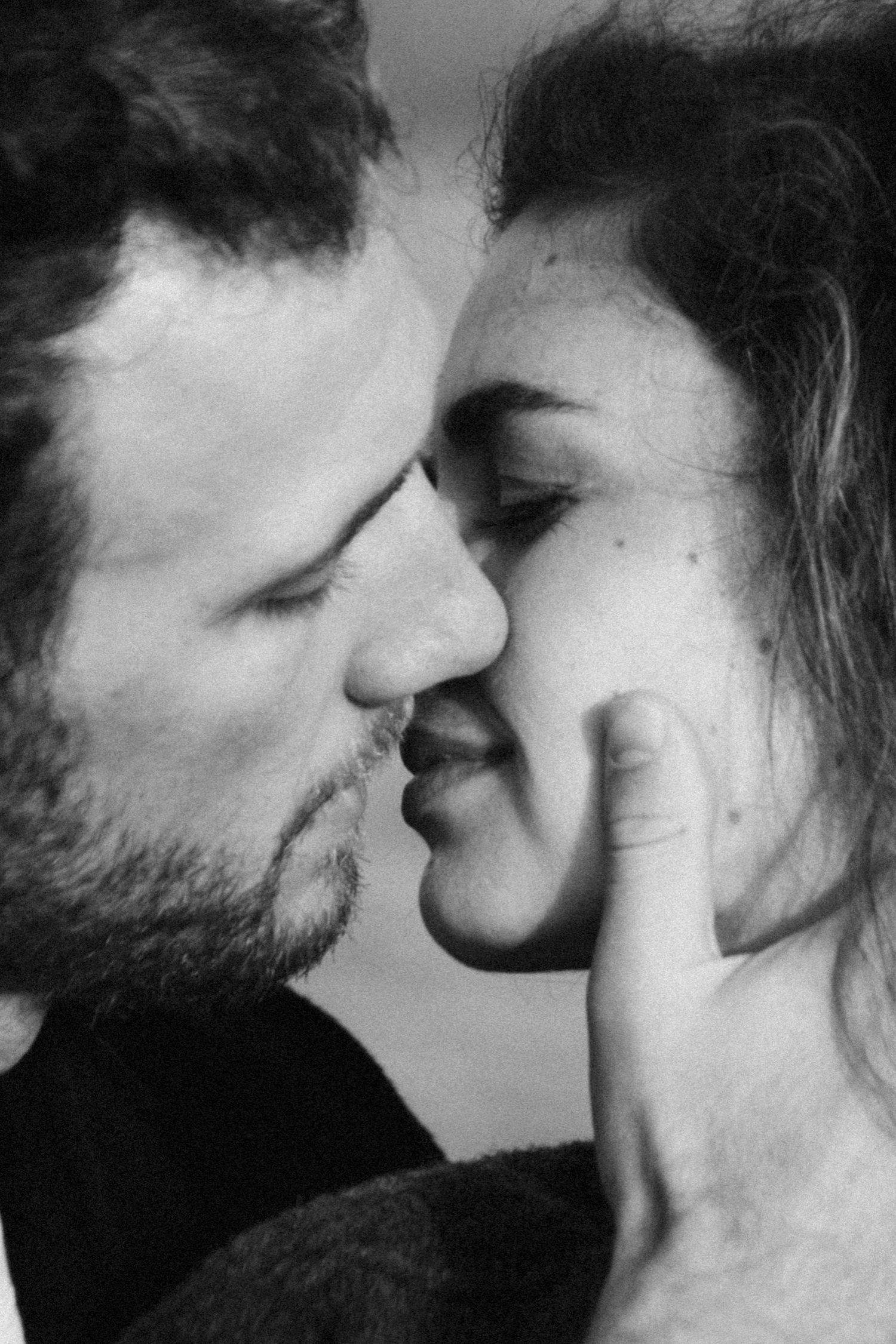 Black and white artistic photo series showing a couple in an intimate close-up sequence of romantic moments.