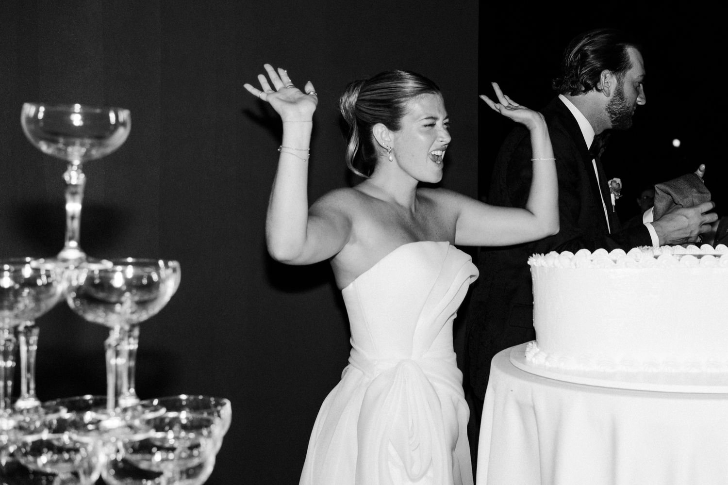 Wedding reception celebration captured in black and white photography.