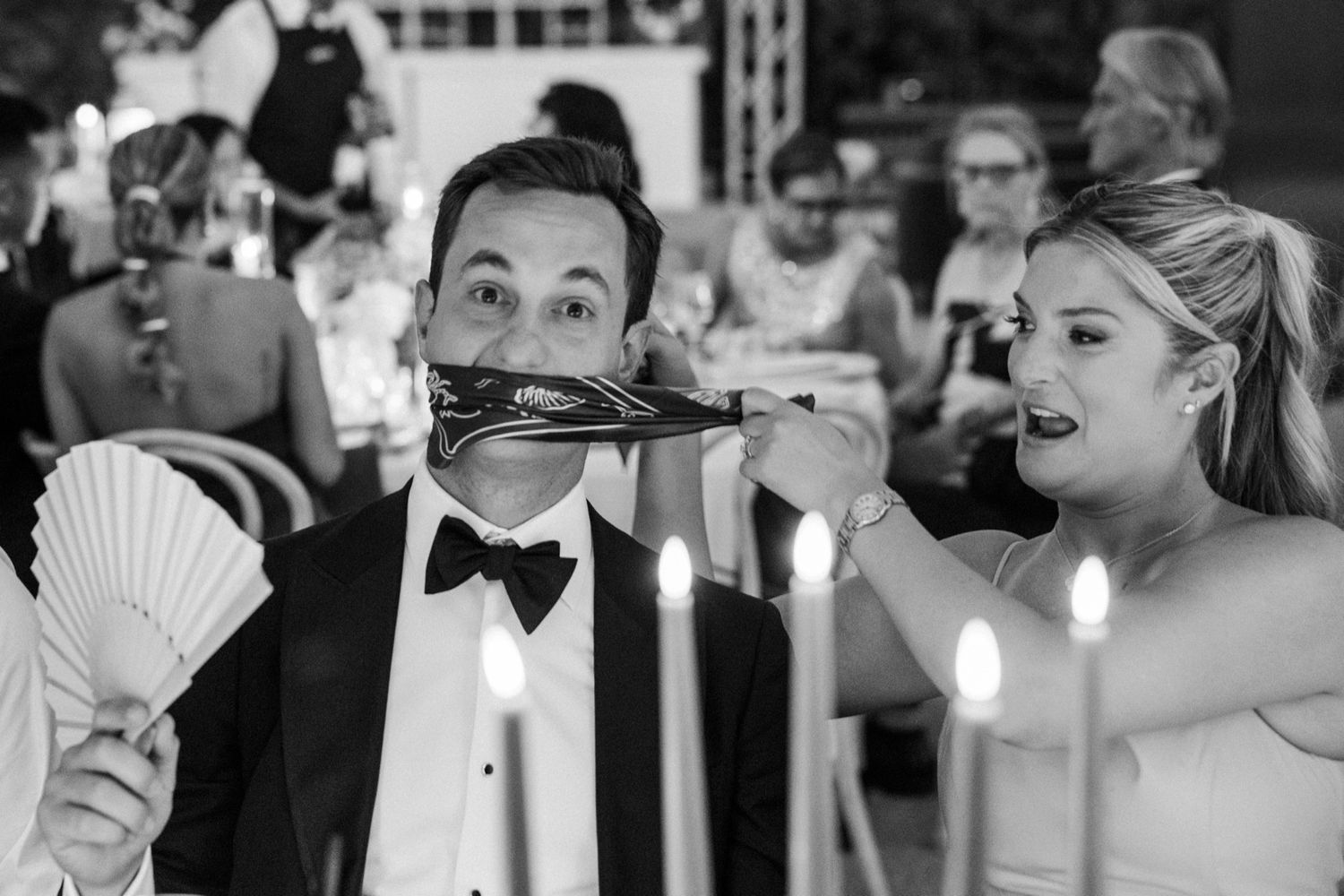 Wedding celebration candid moments captured in black and white photography.