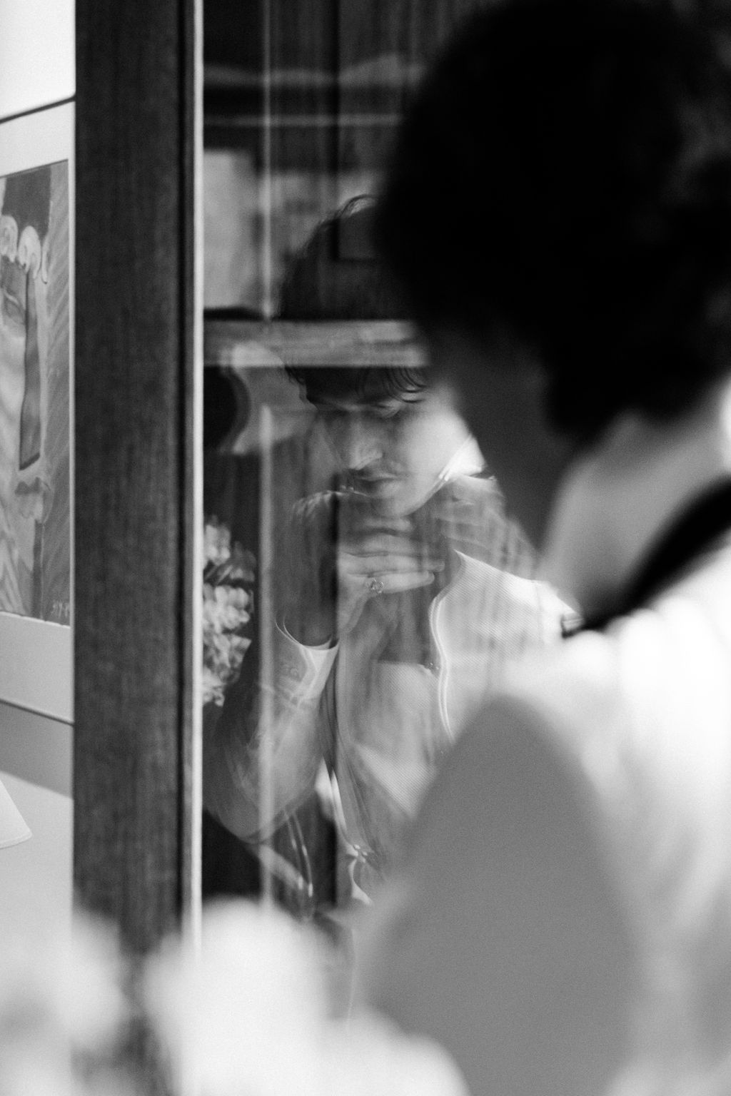 Artistic black and white candid shots of wedding day preparations.