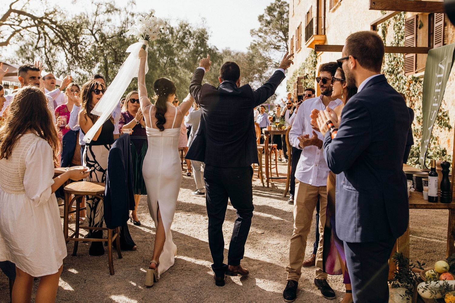 A series of candid moments at an outdoor wedding reception with guests mingling and celebrating together.
