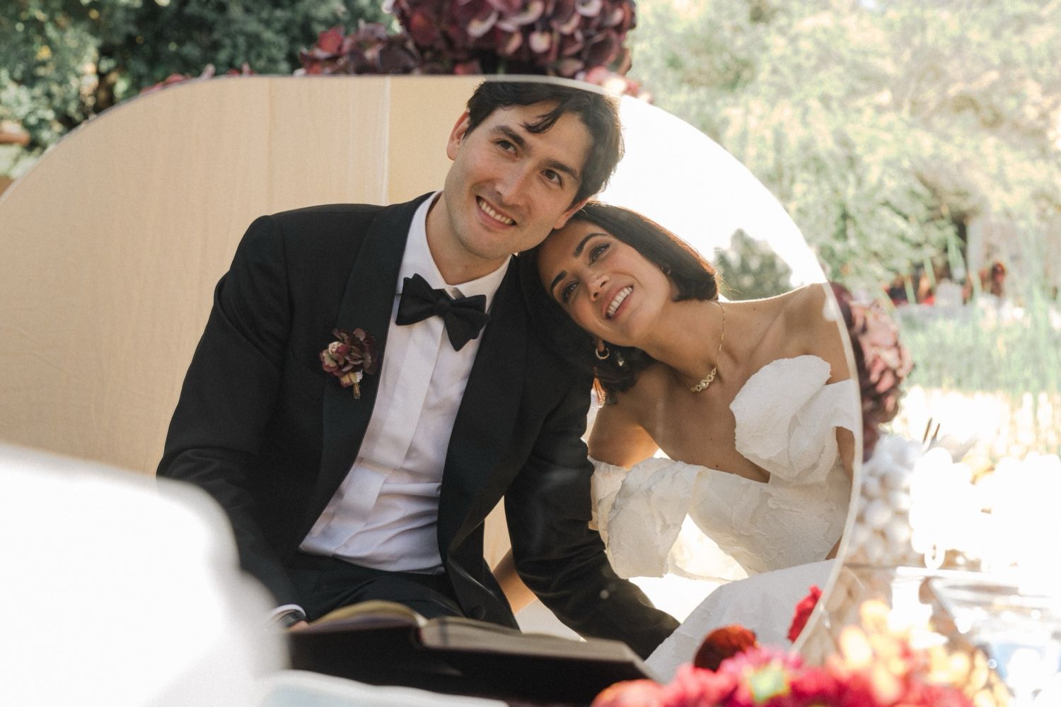 A happy couple shares a tender moment together at their wedding celebration.