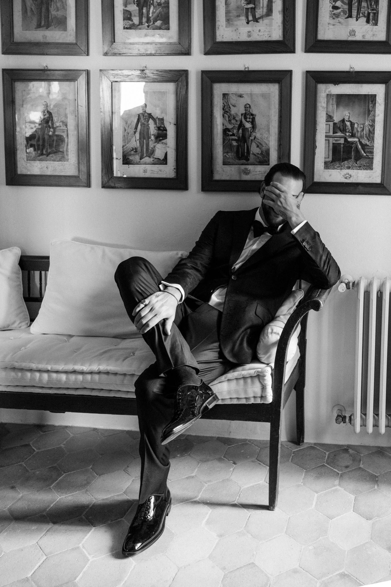 Series of artistic black and white photos showing a person lying on a bench beneath framed artwork.