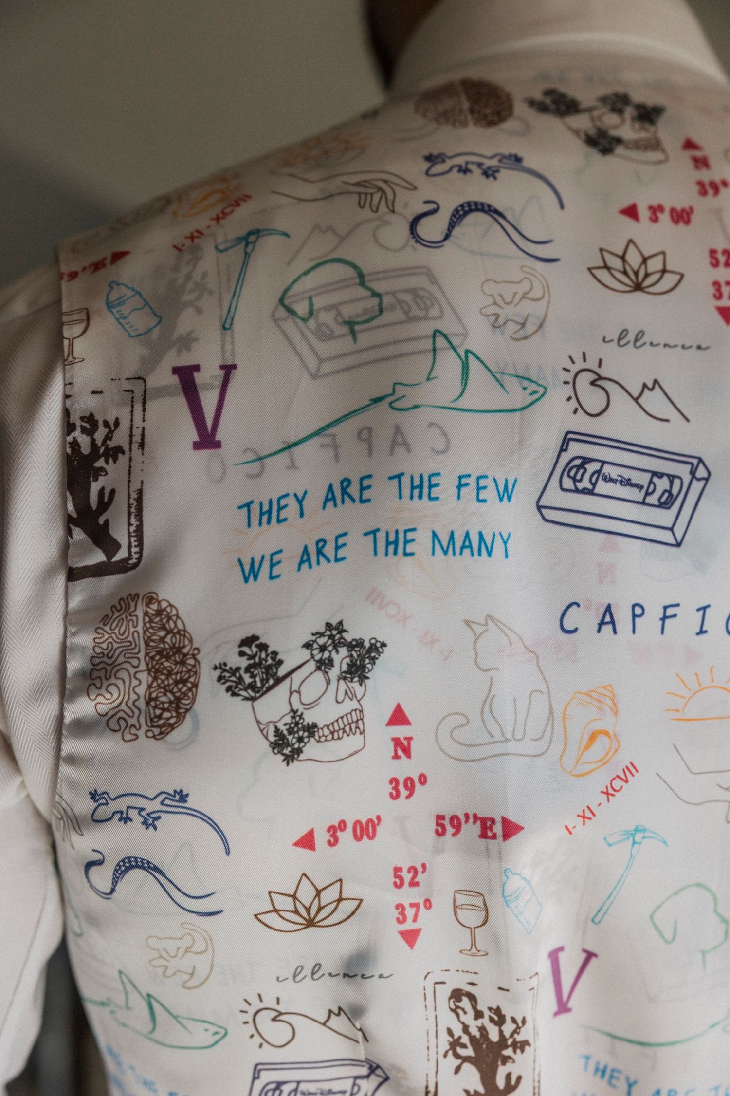 Colorful doodles and text drawings on a white surface featuring various artistic elements and phrases.