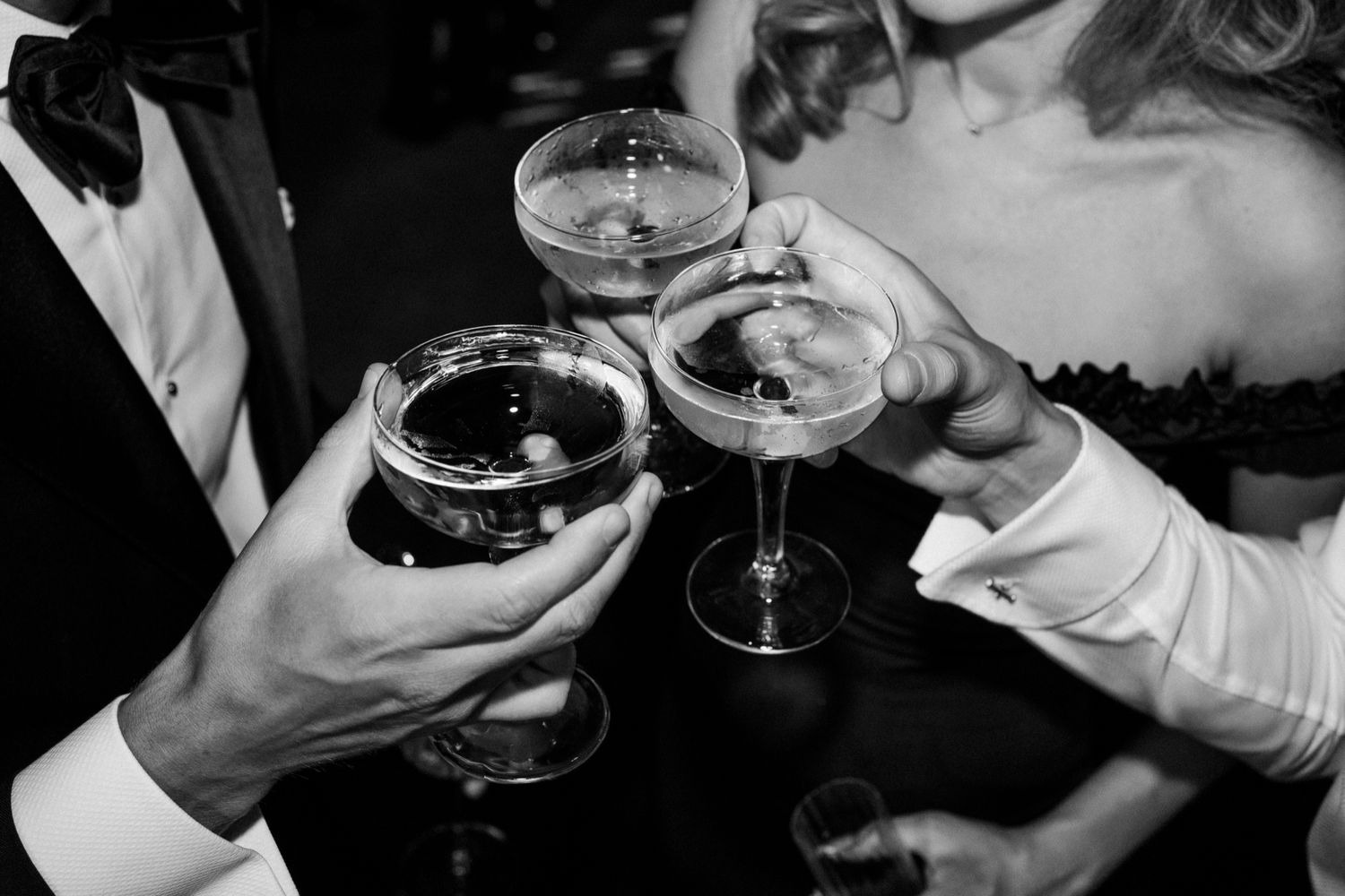 Close-up shots of champagne toasts during wedding celebration.