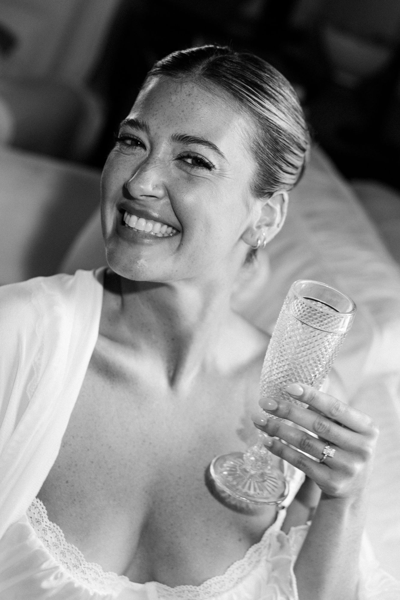 Close-up sequence showing someone holding a crystal glass in natural light.